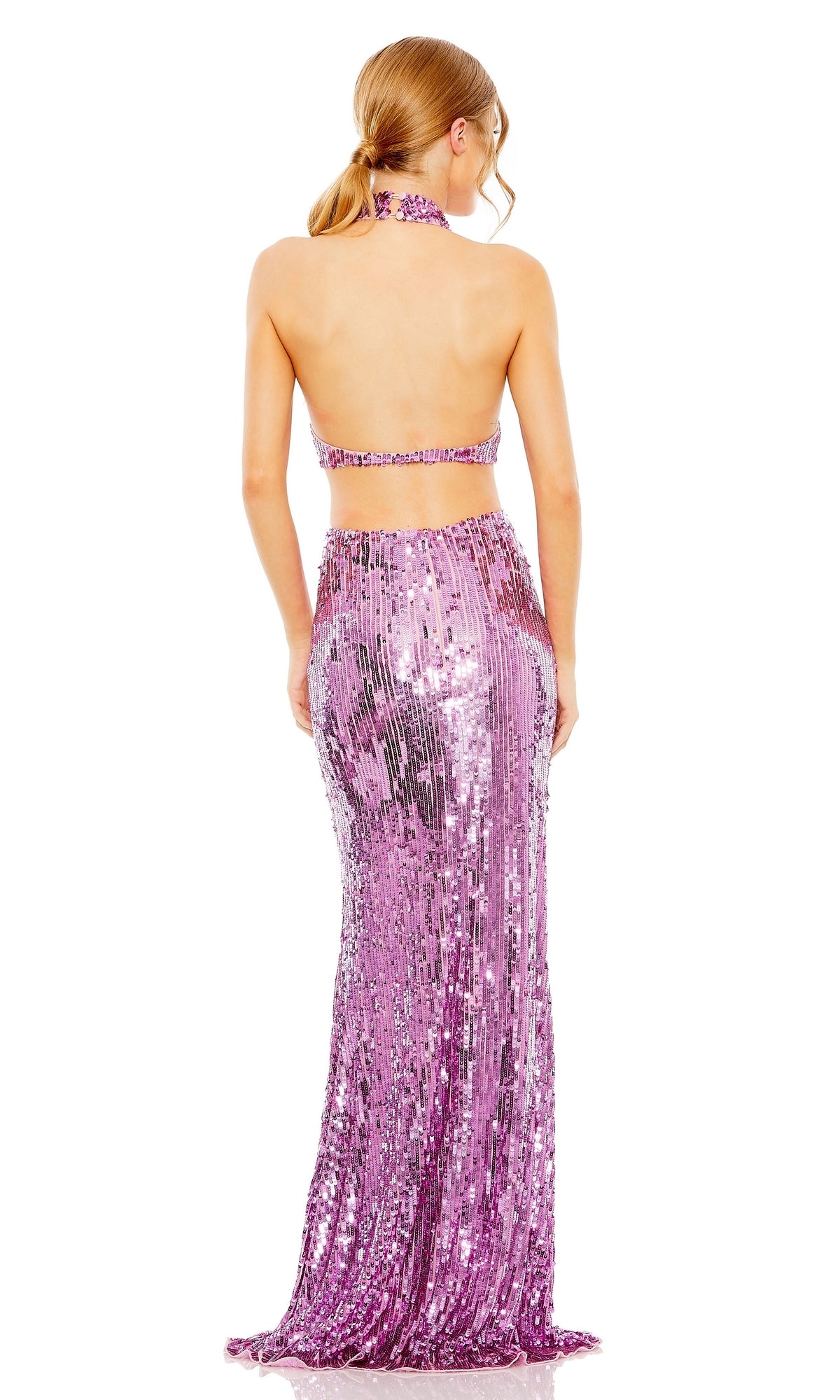 A person faces away, wearing the Long Formal Dress 93976 by Mac Duggal—a floor-length, fitted gown featuring a sleeveless, backless halter style and shimmering pink sequins.
